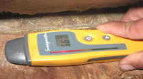 Image of Protimeter Testing Moisture In Floor